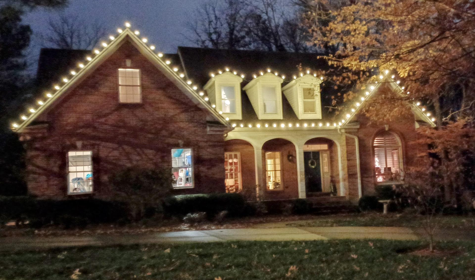 a house with warm white christmas lights in Paducah KY