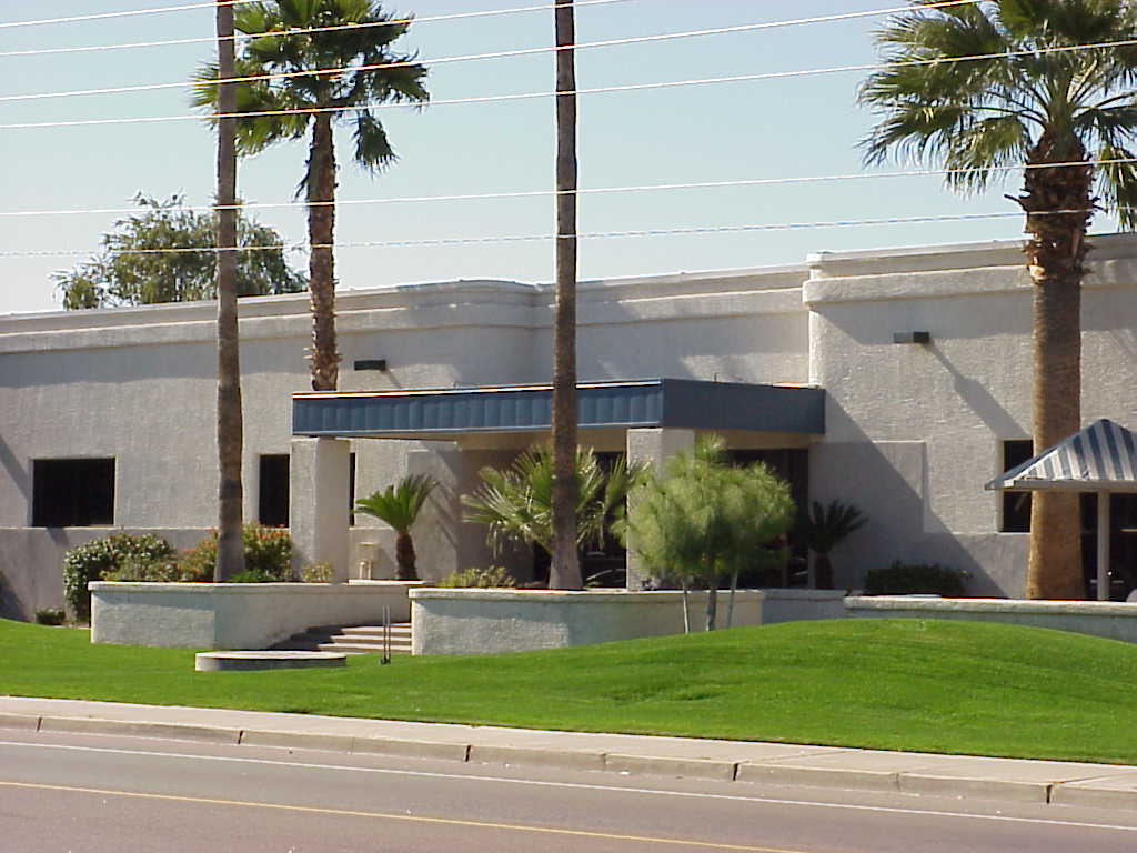 Modern commercial building at 914 S. 52nd Street with a trimmed lawn and palm trees Modern commercial building at 914 S. 52nd Street with a trimmed lawn and palm trees