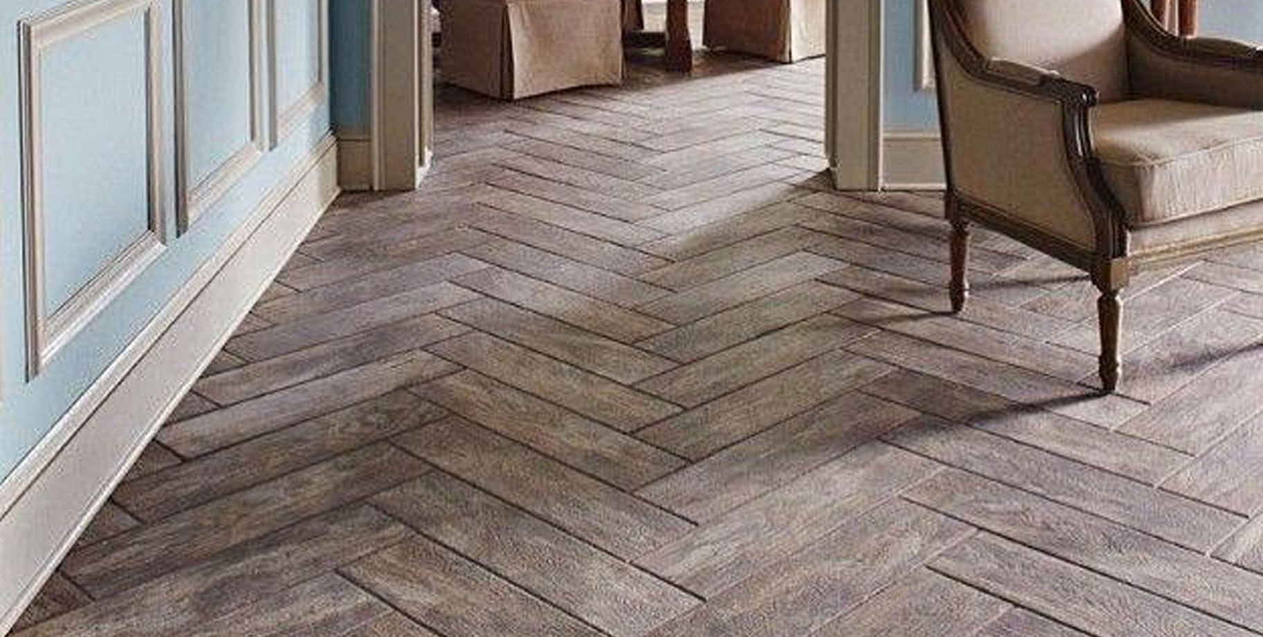 a wood floor with a table and chairs