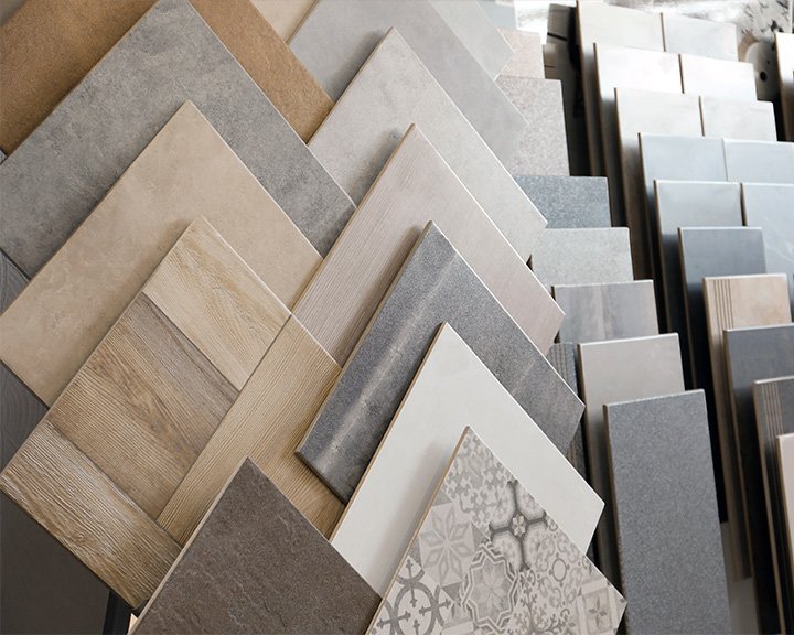 Fanned display of tile flooring samples in various tones and patterns