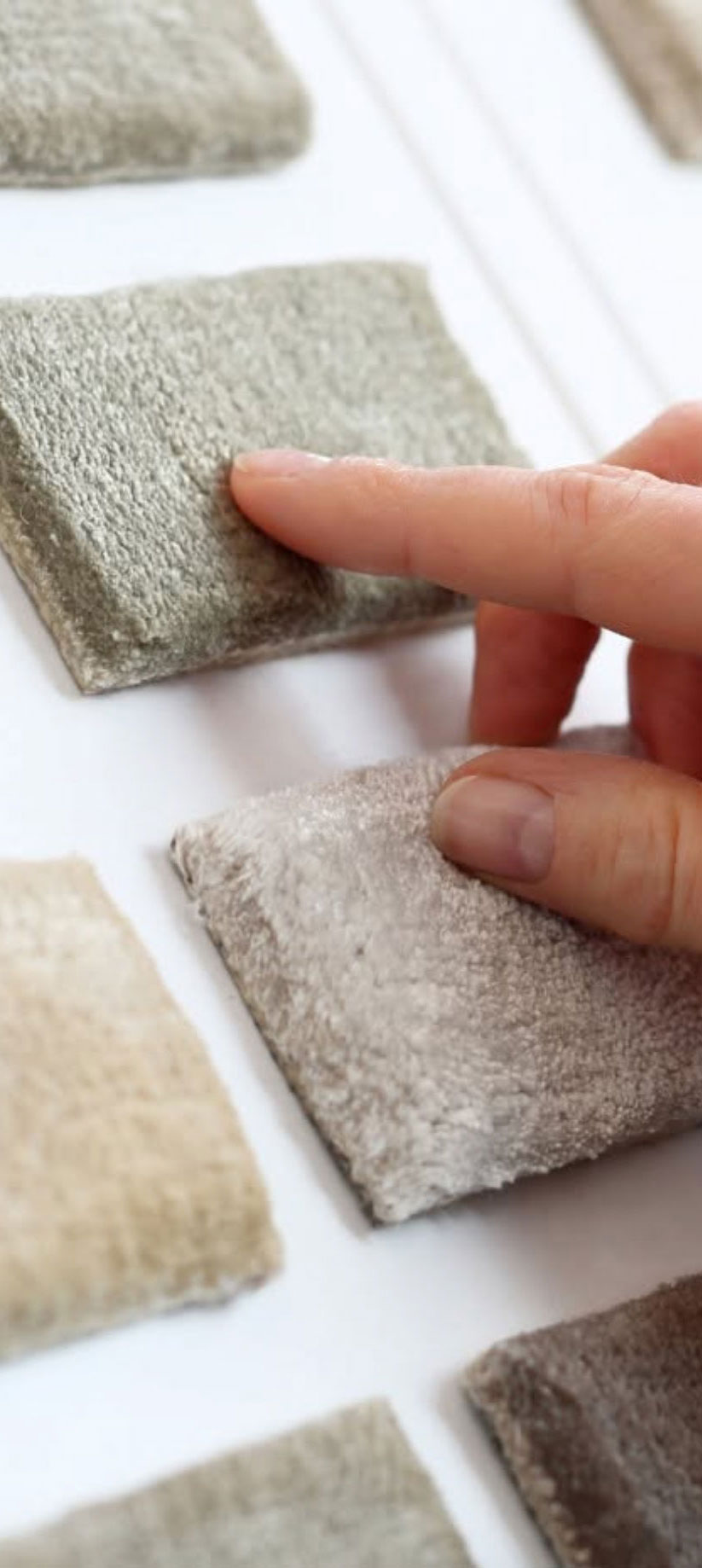 a person touching a carpet samples a person touching a carpet samples