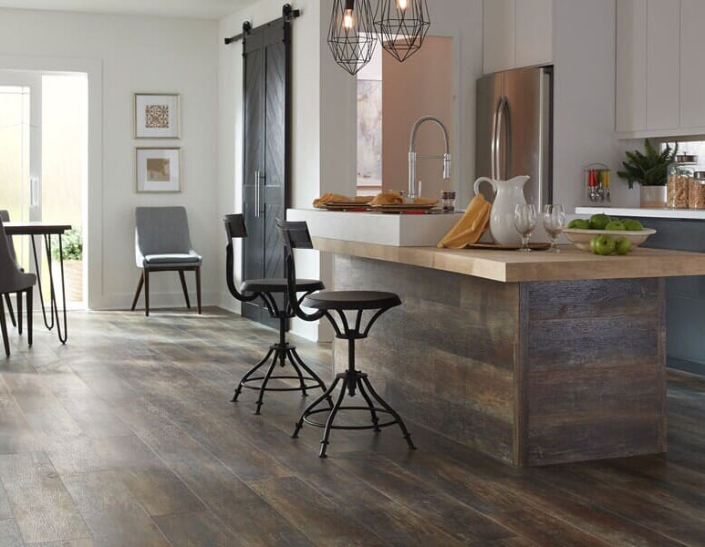 a kitchen with a bar and stools a kitchen with a bar and stools