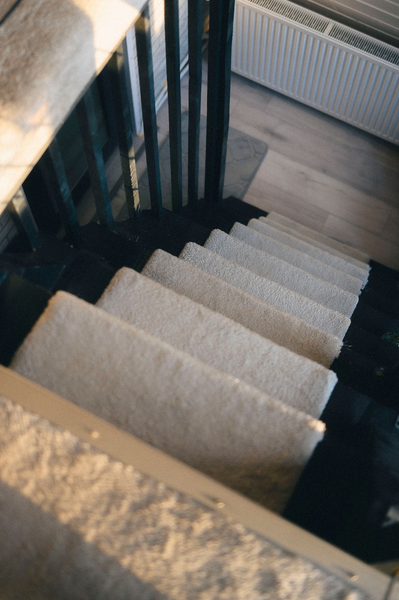 a set of white carpeted stairs a set of white carpeted stairs