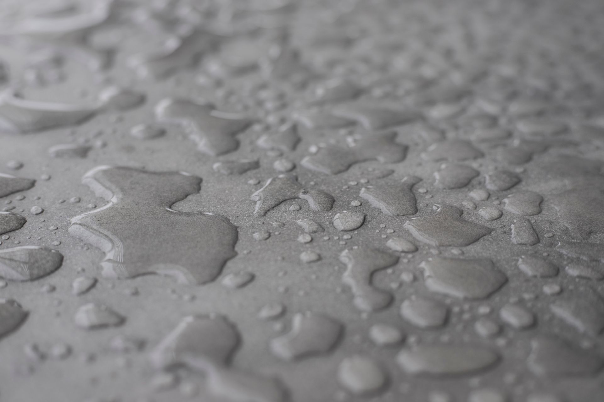 water droplets on a surface water droplets on a surface