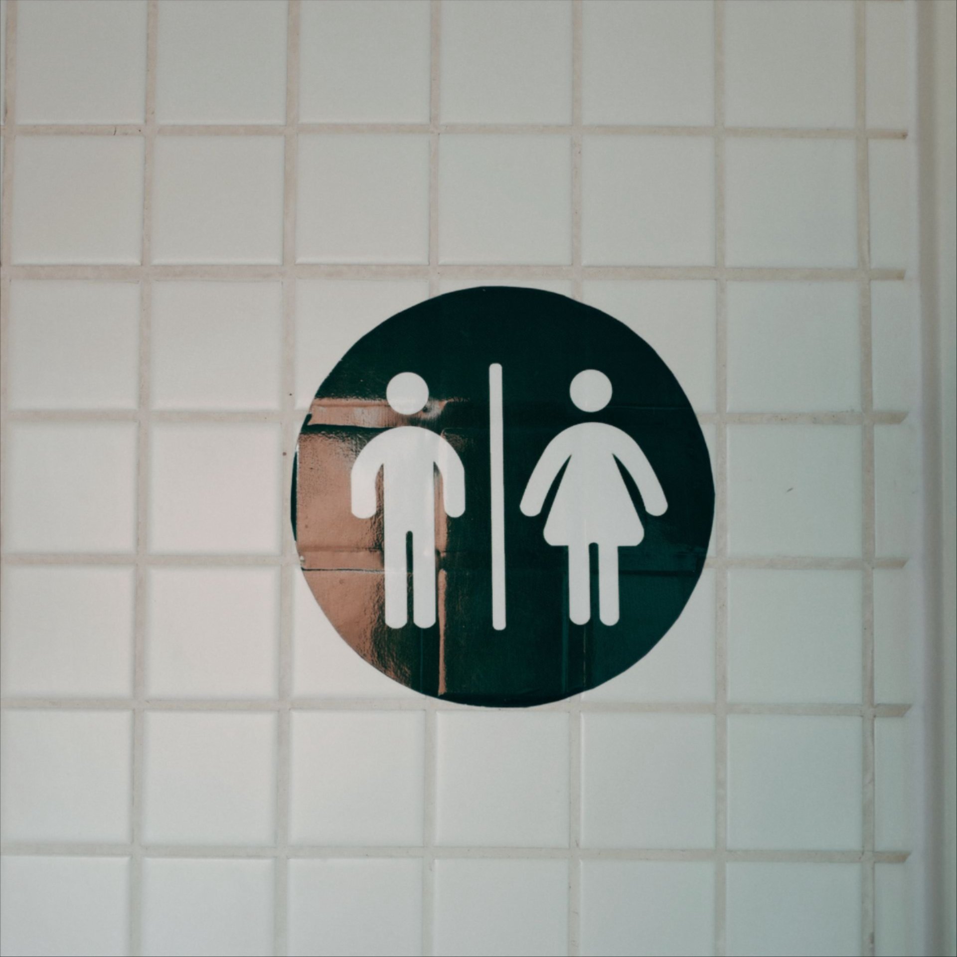 restroom sign on a wall
