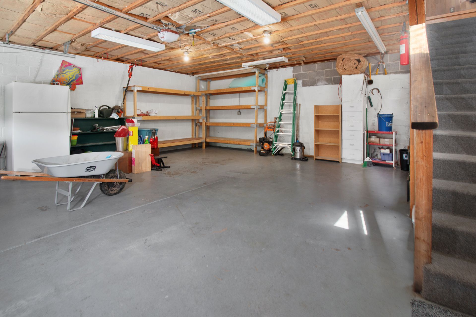 a garage with shelves and tools a garage with shelves and tools