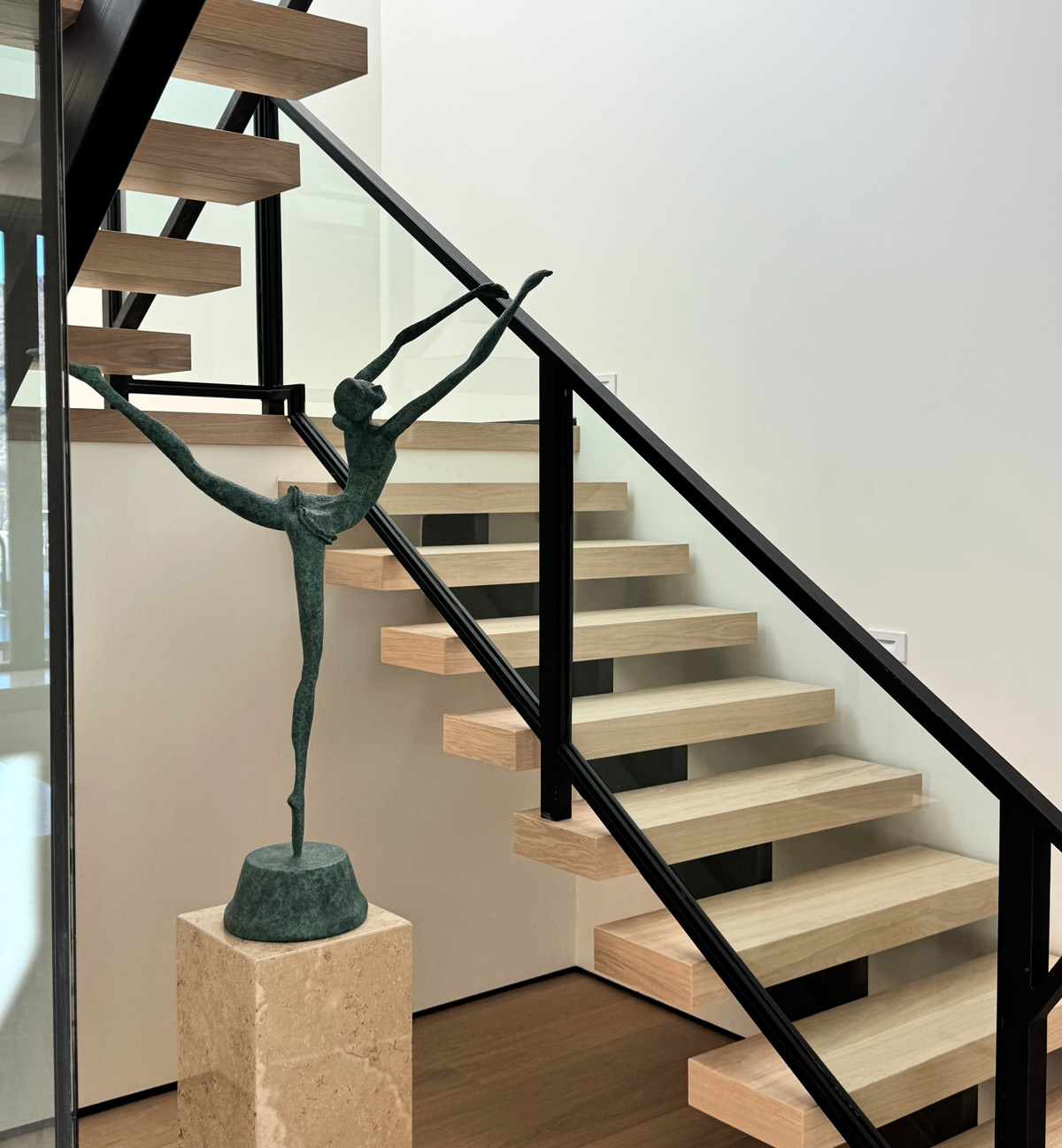 floating staircase - wood floor and sculpture - Experience Luxury Hardwood Flooring in Scottsdale, AZ | The Hardwood Club