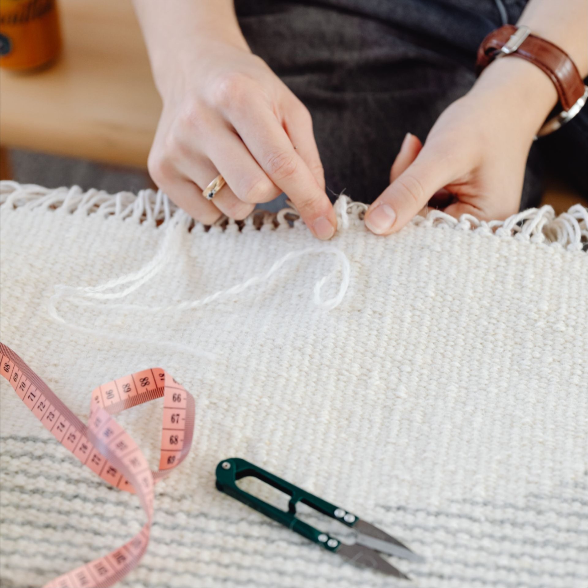 a person reparing a rug a person reparing a rug